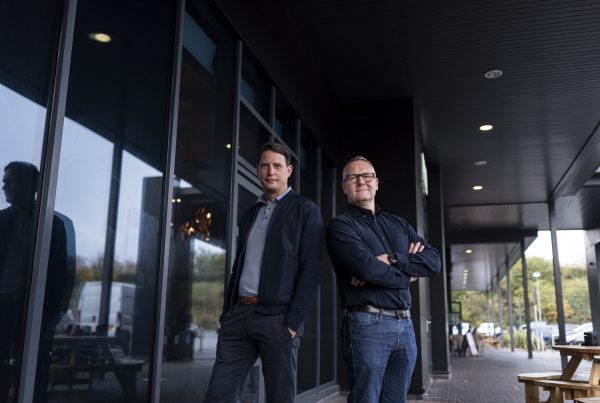 Ben Muncaster and Ant Morse pose outside of building