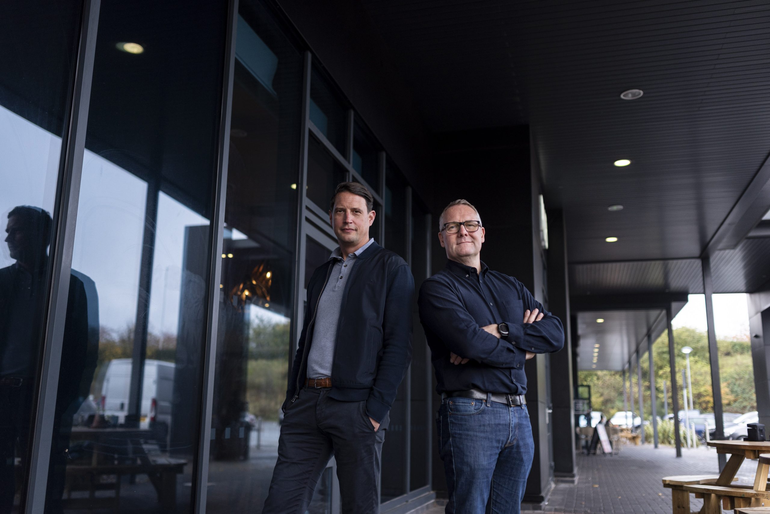 Ben Muncaster and Ant Morse pose outside of building